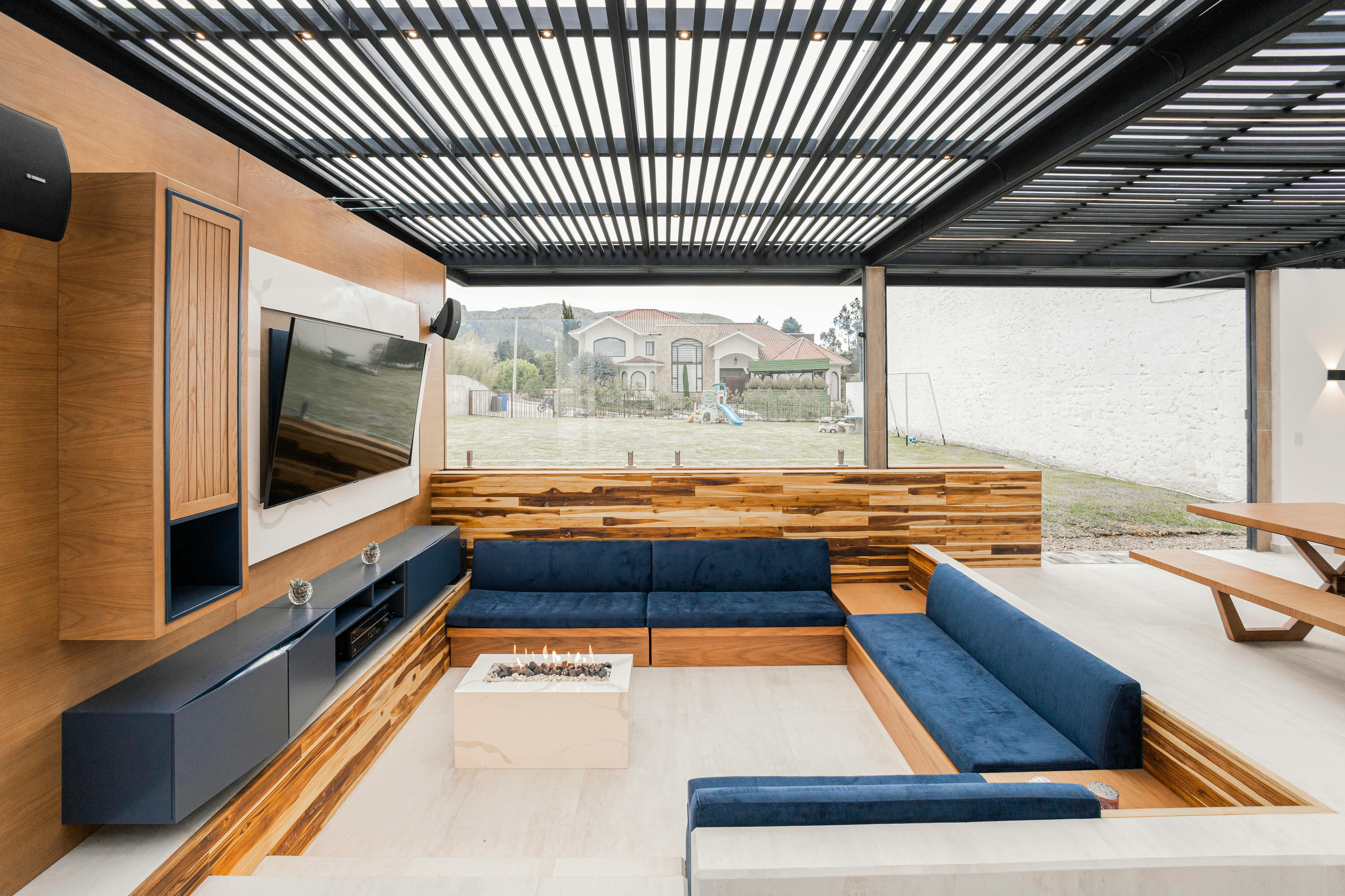 Outdoor TV and landscape speakers on a patio